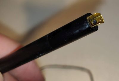 The tonearm grounding insert, halfway removed here The tonearm grounding clip, halfway removed here